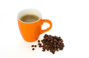 Coffee in a mug and coffee beans