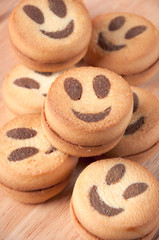 Close-up of smiley biscuits on a wooden board