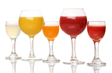 Tropical juices in glasses isolated on white