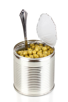 Open Tin Can Of Peas With Spoon Isolated On White