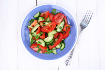 Fresh salad with tomatoes and cucumbers