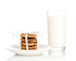 Glass of milk and cookies isolated on white