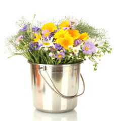 beautiful bouquet of bright  wildflowers in bucket, isolated