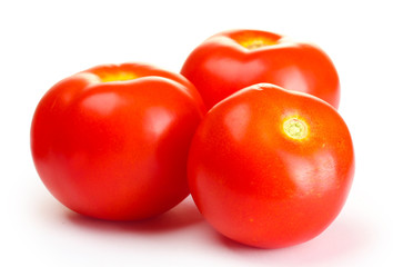 Ripe red tomatoes isolated on white