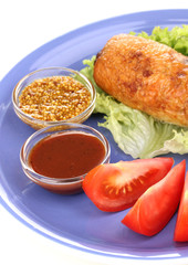 Tasty meat cutlet with garnish on plate isolated on white