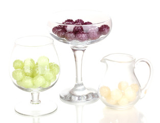Color candies in glasses isolated on white