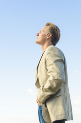 man standing in profile