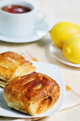 Puff buns, lemons and tea