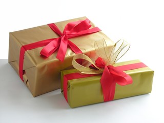 Obraz na płótnie Canvas christmas gifts with red ribbon