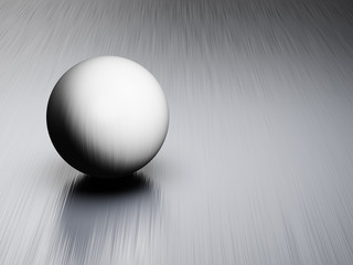 Metal ball on brushed steel plate