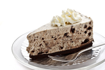 piece of cookie and cream cheese cake on white background