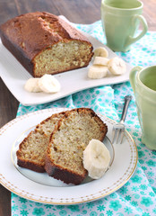 Freshly Baked Banana Bread with fresh bananas.