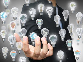 Man holding light bulb object