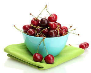 Ripe cherry berries in bowl isolated on white