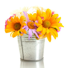 beautiful bouquet of bright wildflowers in bucket, isolated