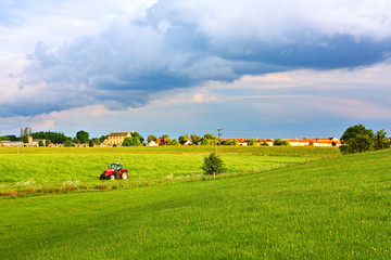 A red tractor in the fields of Scotland, Springtime