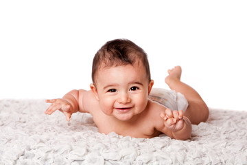 Happy baby laying on belly