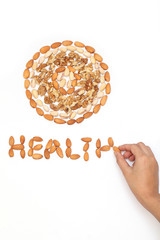 Almond,pistachios and wall nuts are arranged on white