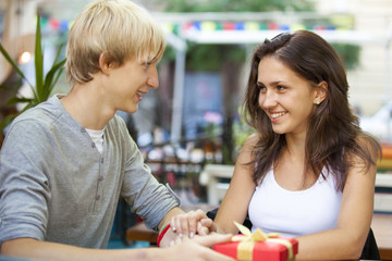 The young man and girl in the cafe