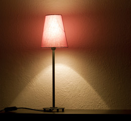 Lamp on the shelf in night abstract background