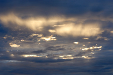 Fototapeta na wymiar clouds in a golden sunset