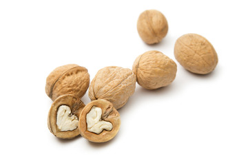 Heap of walnuts on white
