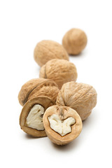 Heap of walnuts on white