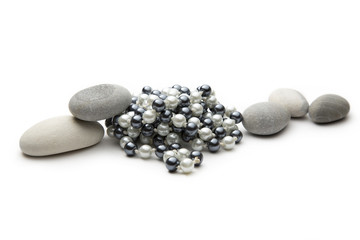 Fototapeta na wymiar String of black and white pearls and stones