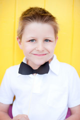 Cute boy with bow tie party accessory