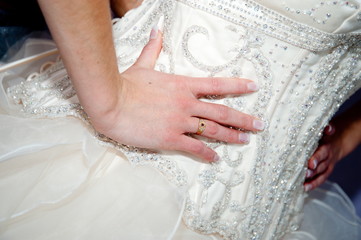 Bride's hands on hips