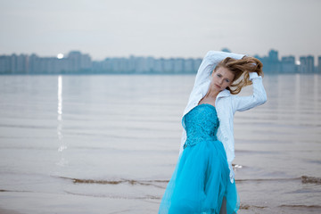 Fototapeta na wymiar Lonely woman on the beach