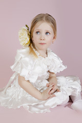 little girl in a white elegant dress