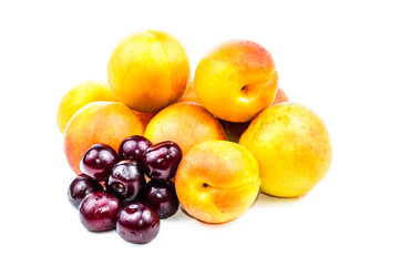 Naklejka na ściany i meble Fruits are ripe apricot and red cherries