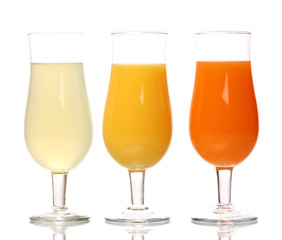 Tropical juices in glasses isolated on white