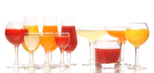 Tropical juices in glasses isolated on white