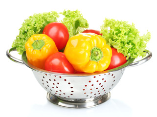 fresh vegetables in silver colander isolated on white