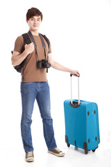 full length of young traveler with suitcase