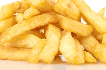 a pile of french fries on a white background