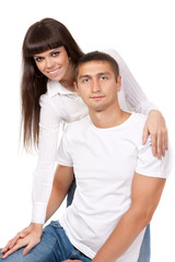 Fototapeta premium Portrait of happy young couple, hugging, smiling.?