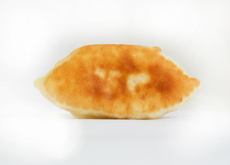 One oven baked pasty over white background. Looks delicious.