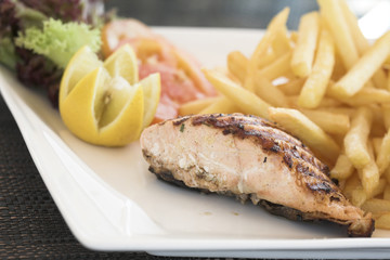 Healthy food, salmon steak and chips