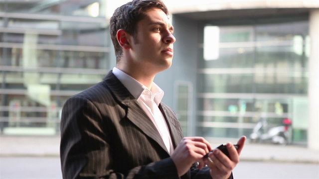 Business man using app on smartphone
