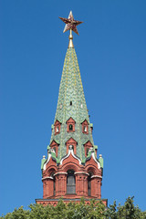 Fototapeta na wymiar Moscow Kremlin Tower with red star closeup isolated on blue
