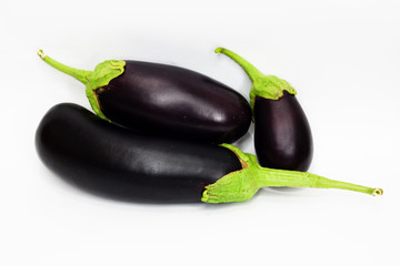 three aubergine on white background