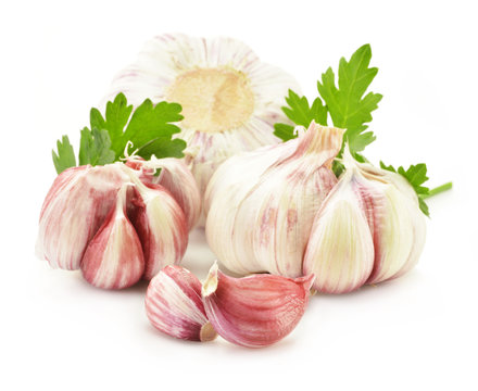 Fresh garlic with parsley isolated on white