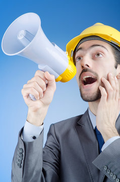 Construction worker shouting via loudspeaker