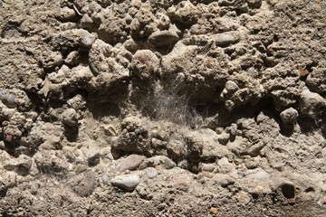 Cracked,chipped and water stained, cement factory foundation.