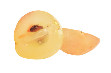 Translucent slice of red grape fruit, macro isolated on white