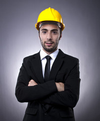 Young investor with construction helmet