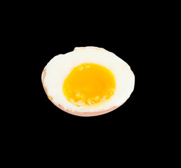 soft-boiled egg on a black background